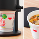 Thanko's Makasetei appliance demonstrated with Cup Noodle cups.